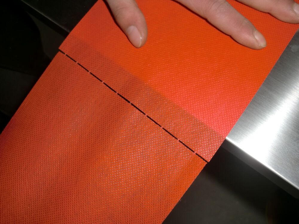 PERFORATED NONWWOVEN LAMINATED FABRIC Photo 01 AAAAA.jpg